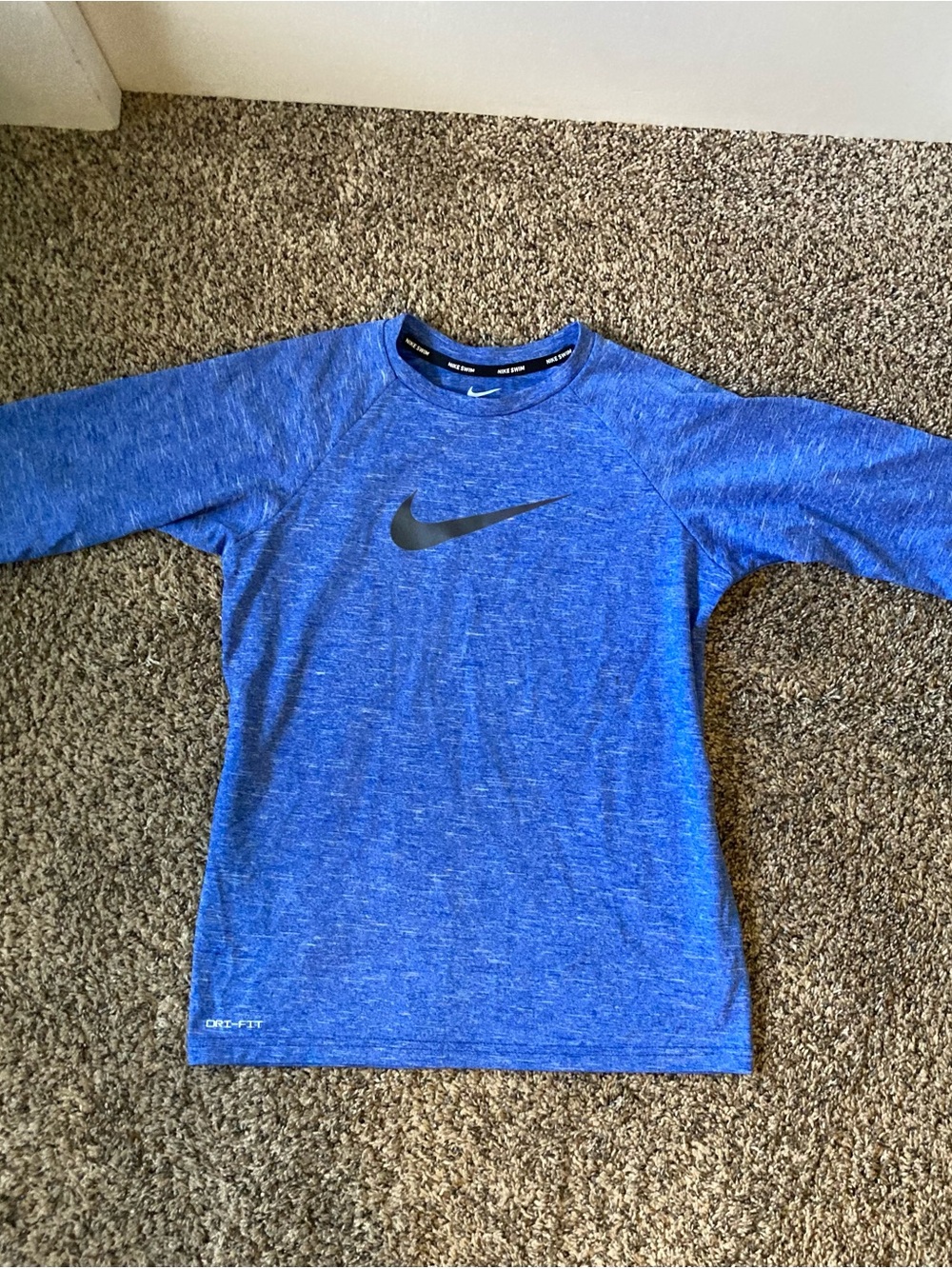 Nike Blue Heather Dri-FIT short sleeve rash guard.